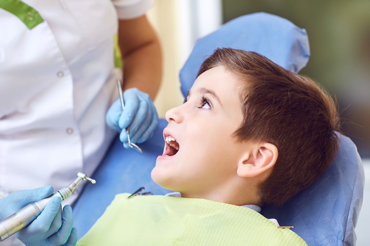 Photo of little boy on the dentist chair and ready for the procedure